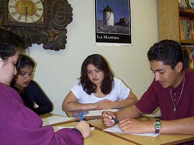 Four students collaborating during Spanish class.