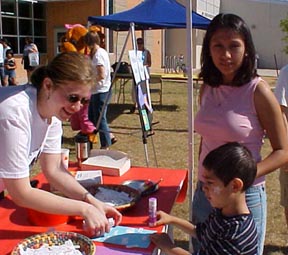 Sarah helping a kid make a poem